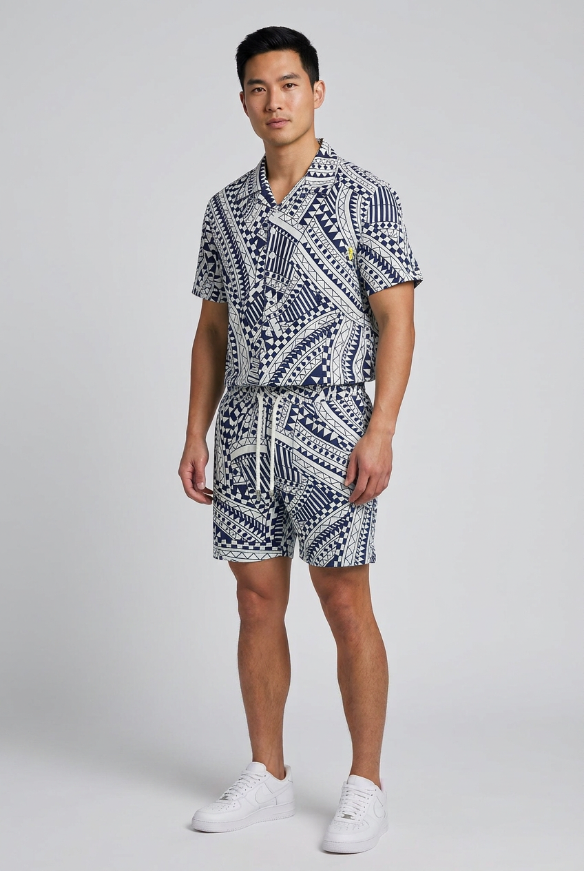 Model wearing the Nijays Couture navy geometric tribal print shirt and matching shorts