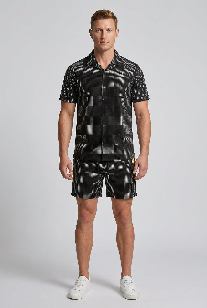 Model wearing the Nijays Couture black micro-dot shirt and matching shorts