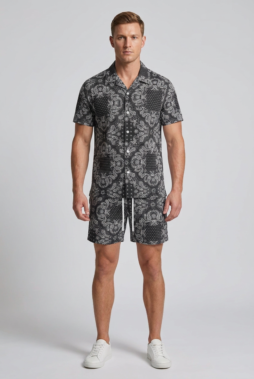 Model wearing the Nijays Couture black and white paisley shirt and matching shorts